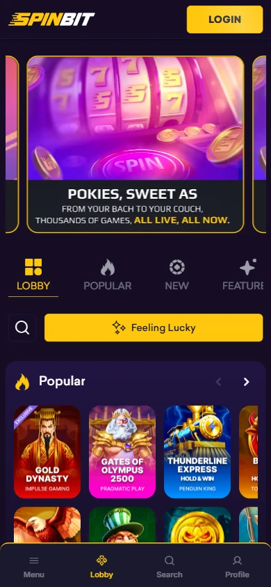 SpinBit mobile lobby with the Pokies, sweet as banner, the Popular row and the bottom bar with Menu, Lobby, Search and Profile